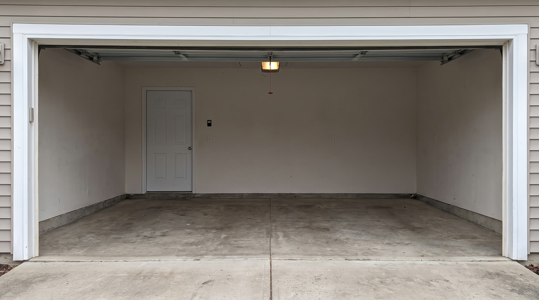Garage after a One Call cleanout — empty and swept