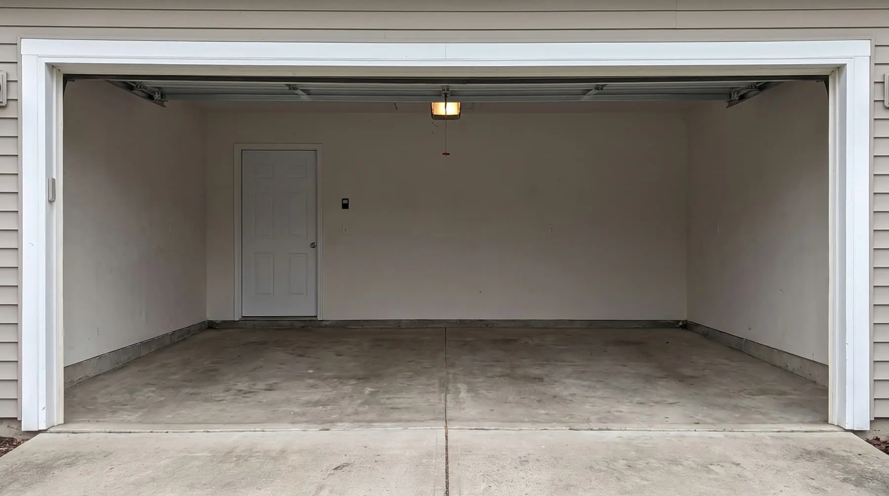 Garage after a One Call cleanout — empty and swept