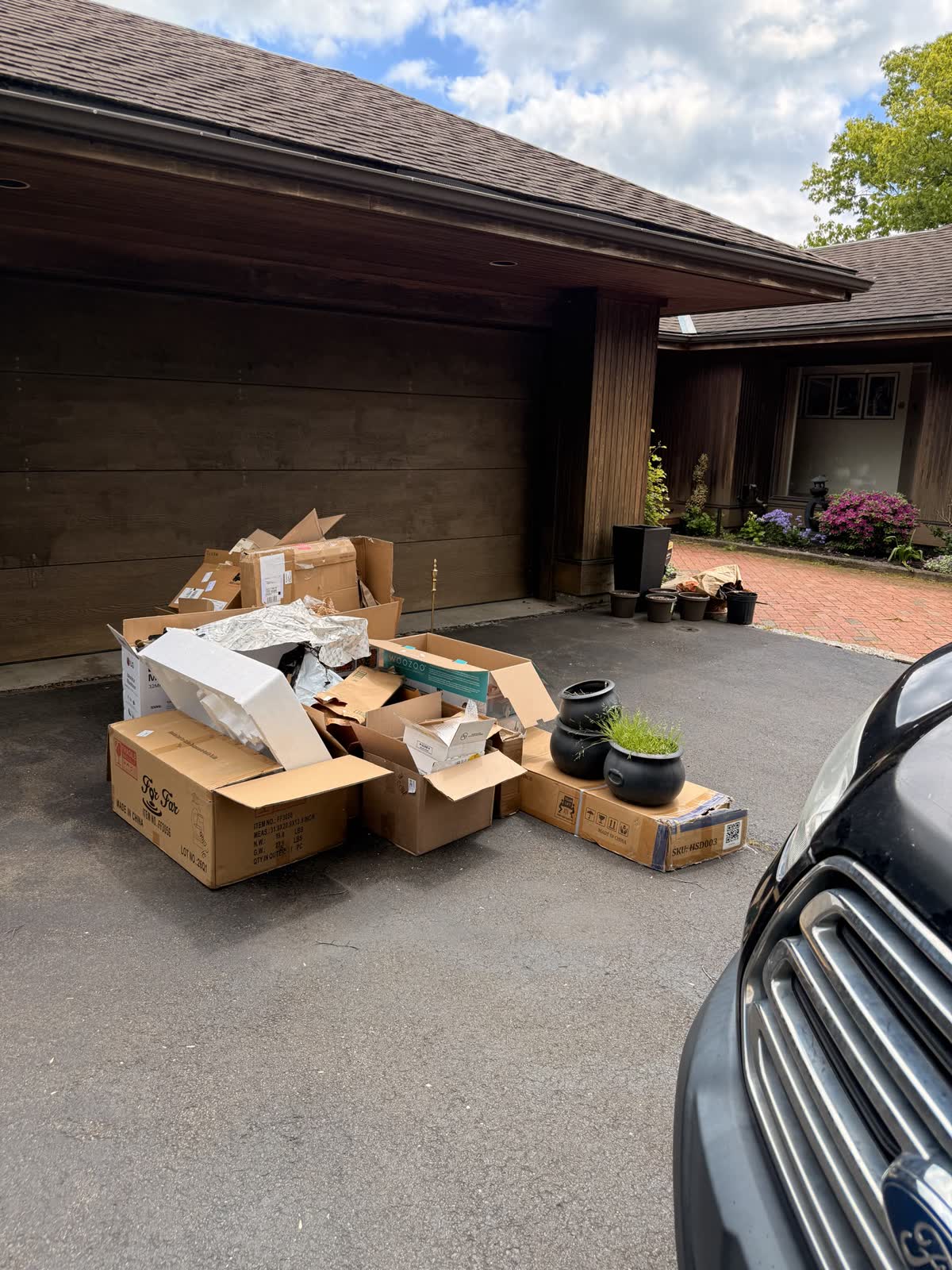 Driveway junk pile before a One Call same-day pickup, Fairfield County CT